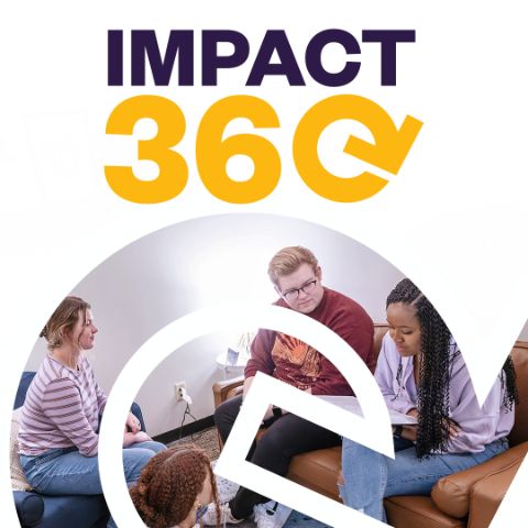 Students walking outside on campus with the Impact 360 log over them