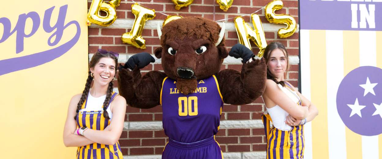 orientation leaders standing next to the bison mascot