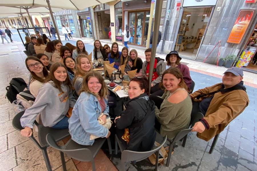 Students enjoying churros together in Spain
