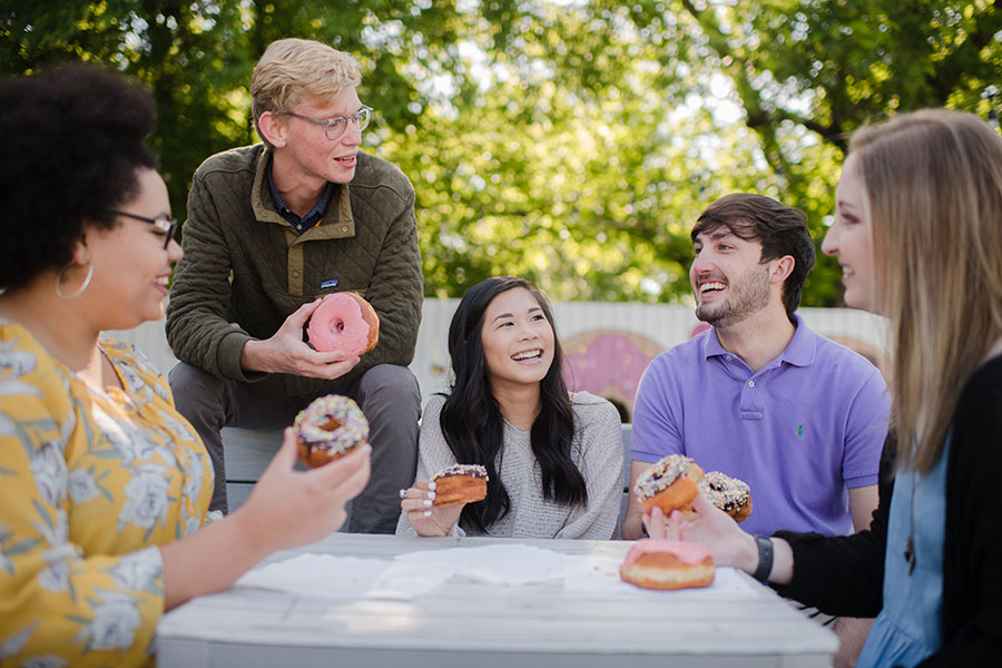 Five students enjoy Five Daughters Donuts in 12South
