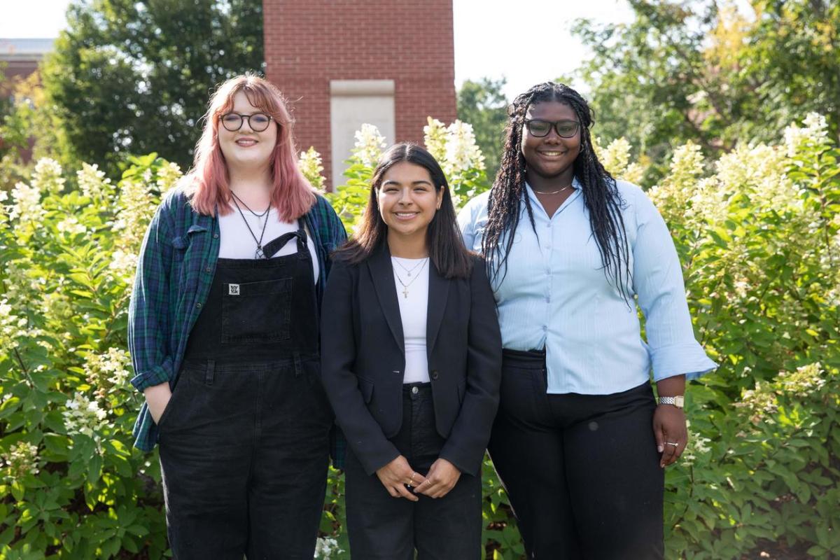 Three scholarship recipients pictured on campus