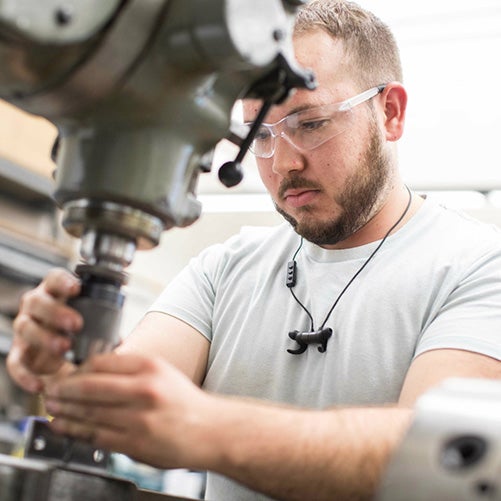 An engineering student works on a project