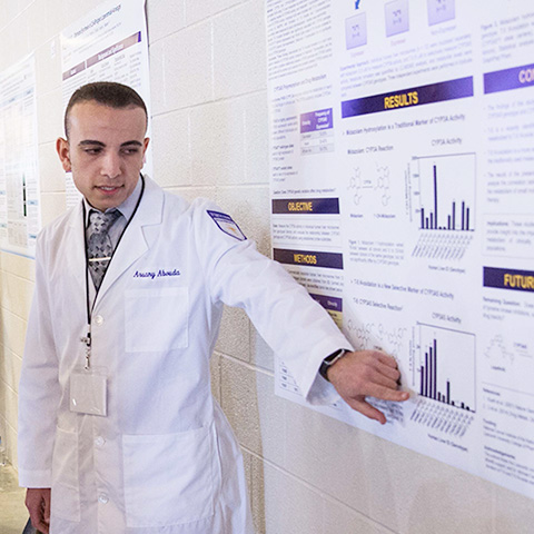 A health science student shares his findings during Student Scholars Symposium.