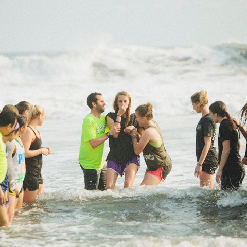 Student is baptised in waters of the Pacific Ocean in El Salvador.