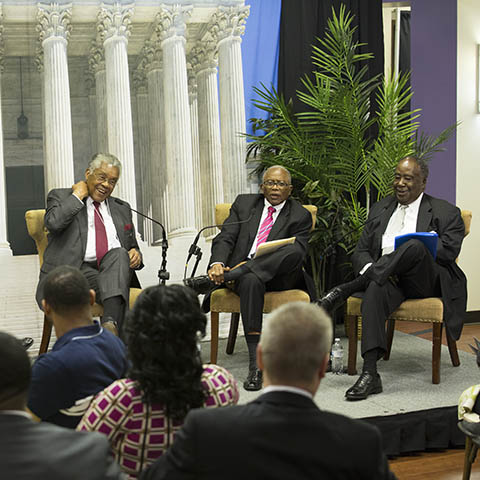 Fred D. Gray and others during a forum