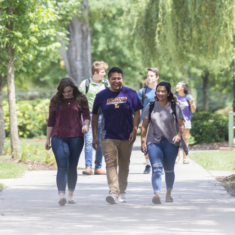 Students walking outside on campus