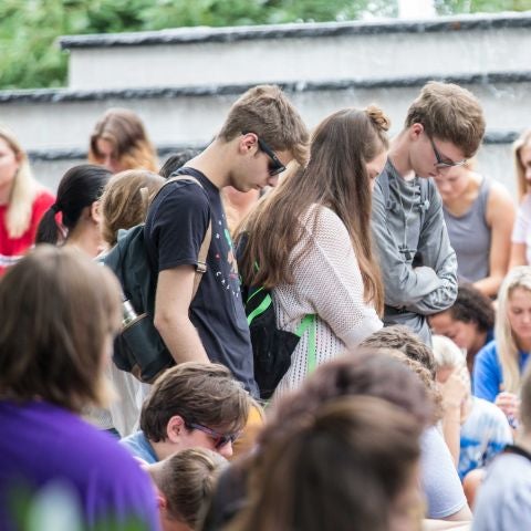 Students praying in the quad