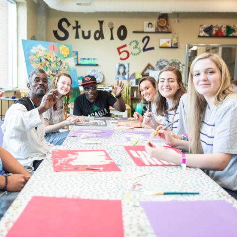 Students painting for QuestWeek service day