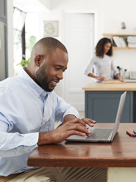 man at desk with laptop