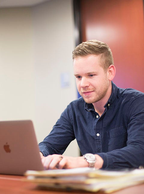 Student working on a laptop