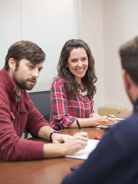 group of people talking at a table