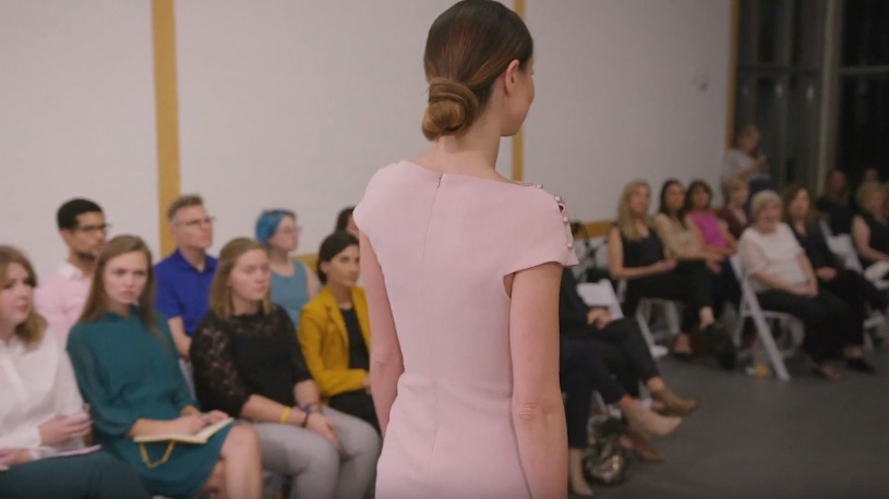 A girl walking in a fashion show