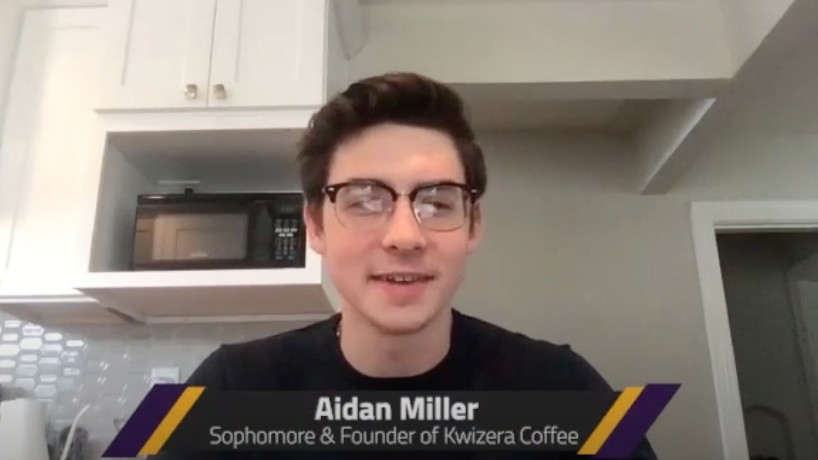Aiden Miller sitting in his kitchen
