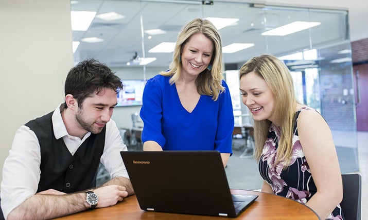 Associate Dean Allison Duke works with College of Business students.