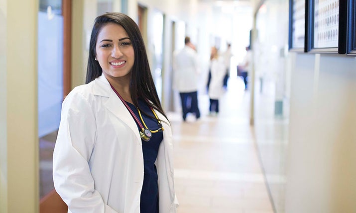 A student nurse smiles. 