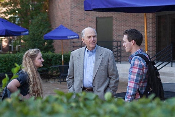 A professor with two students.