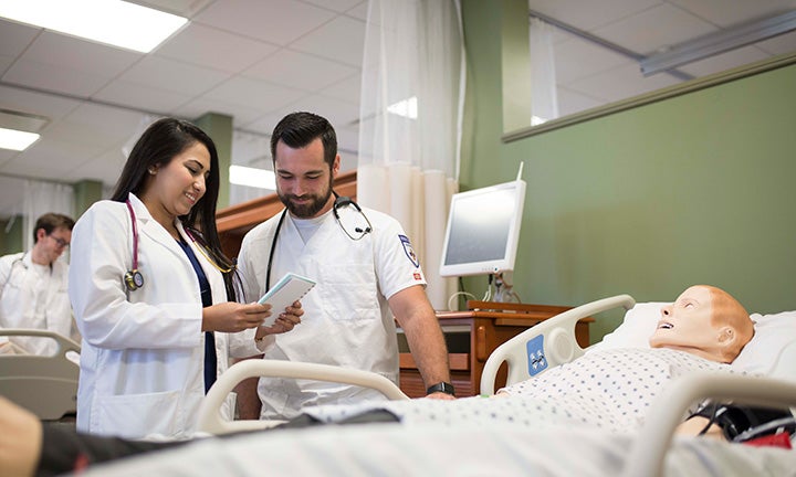 Nursing students practicing on campus