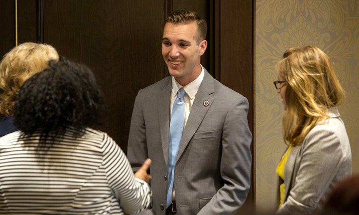 Alum Grant Mathis with community members