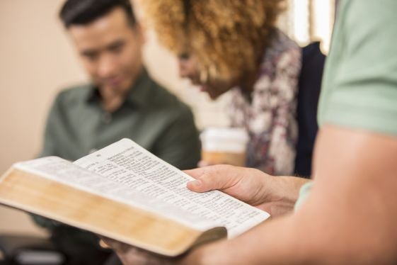 Student reading a Bible