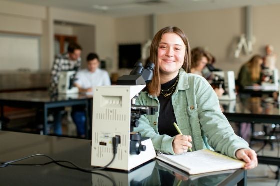 Student with microscope