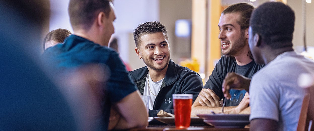 Students meeting over a meal