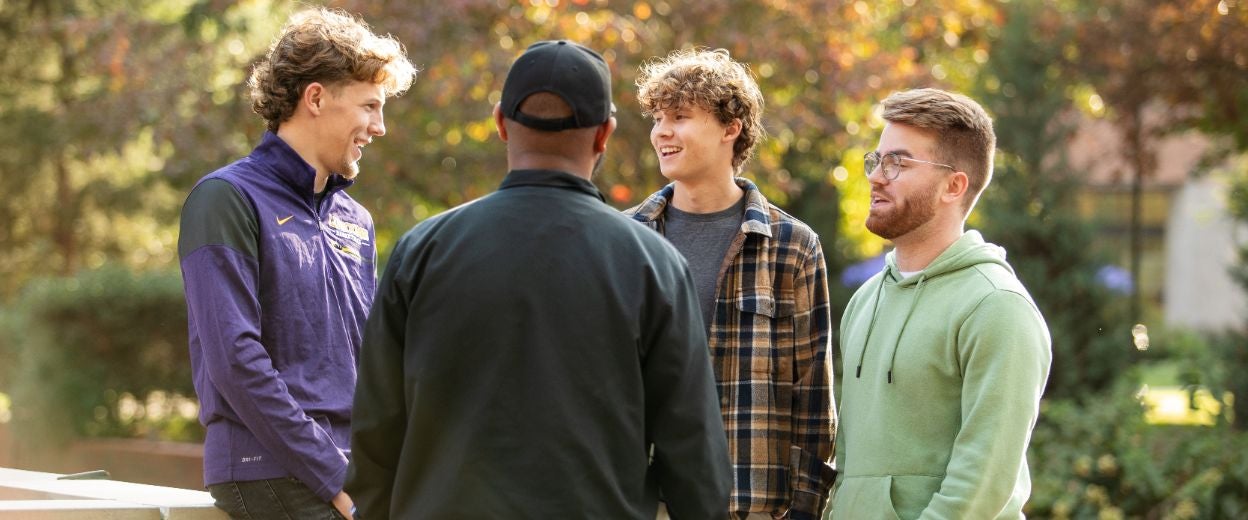 Community College Transfers talking in a group