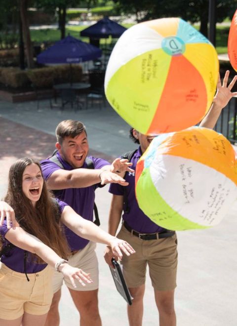 students sending off balloons during questweek