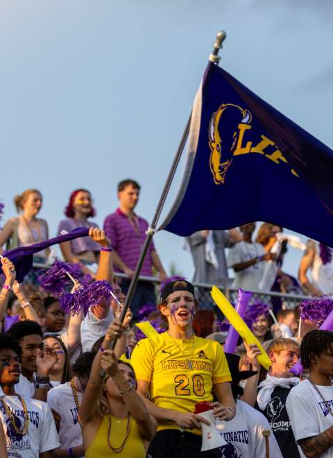 students in the bleachers at a Lipscomb sporting event