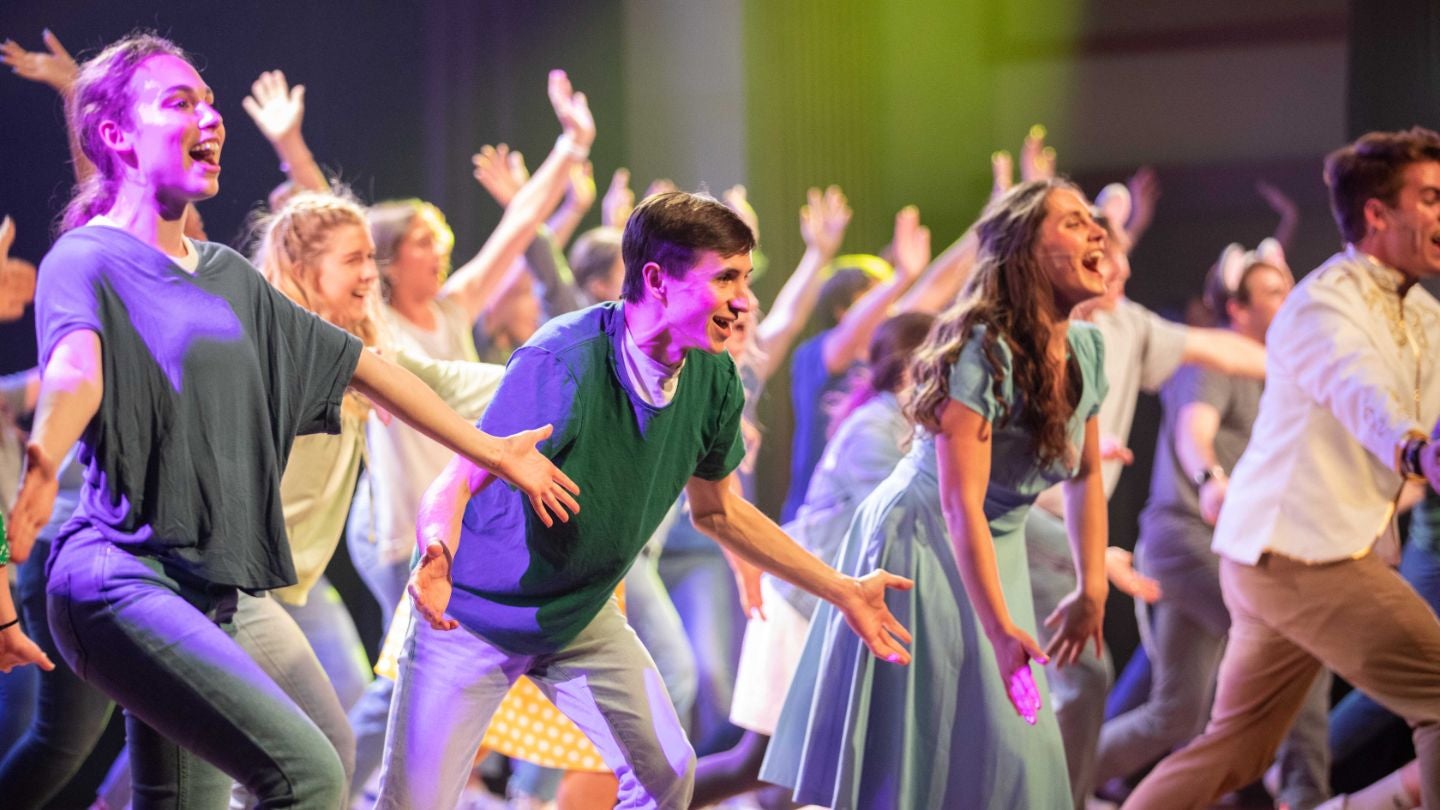 Students on stage performing at Singarama