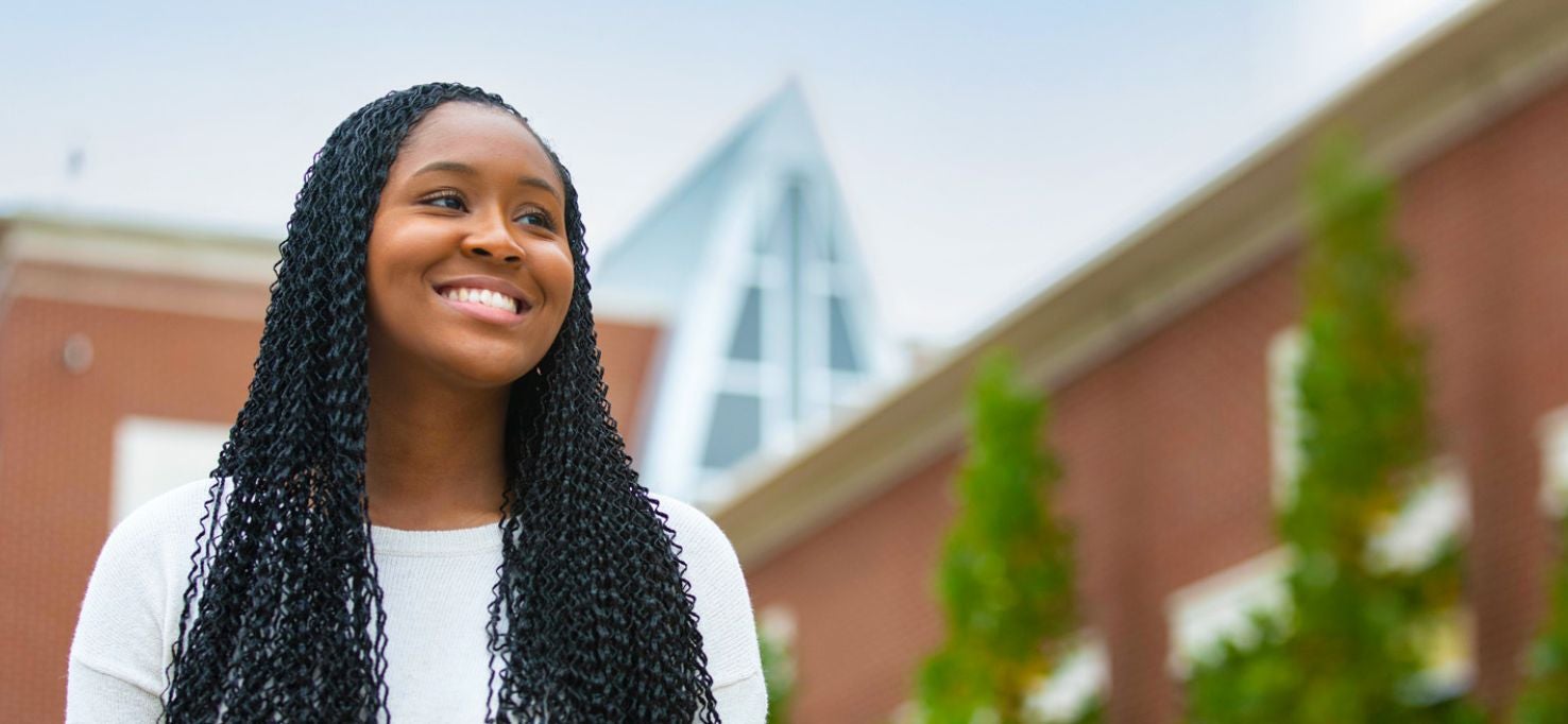 Student smiling on campus