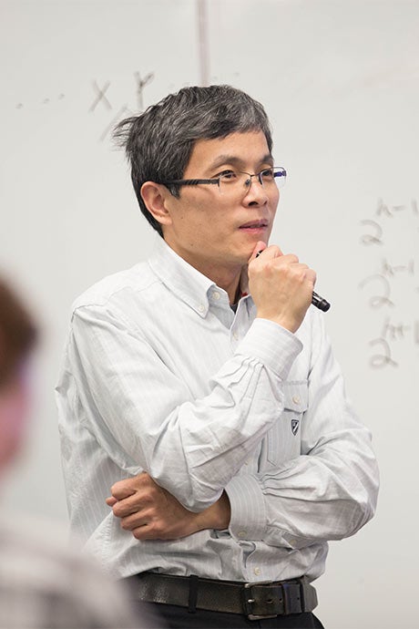 Qingguo Wang visiblily thinking about a problem.