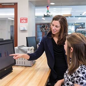 Stephanie Weeden-Wright, left, with student look at test output on a computer screen