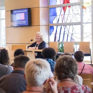 A woman speaks to a group of parents and ministers at the Children's Spirituality Summit