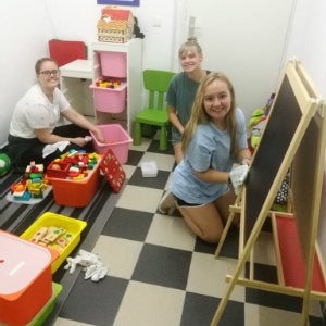 Student cleaning in a nursery in Vienna