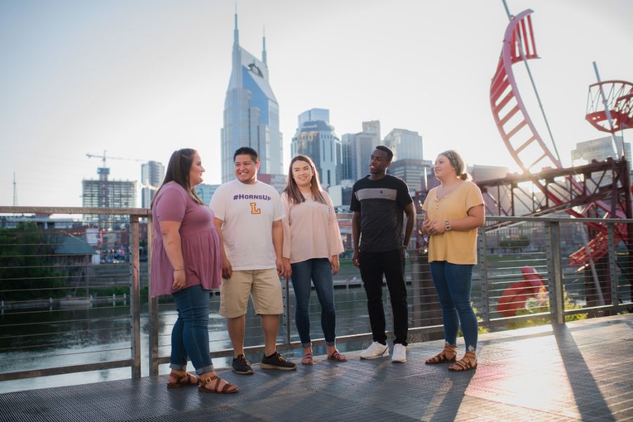 Students in front of the Nashville skyline