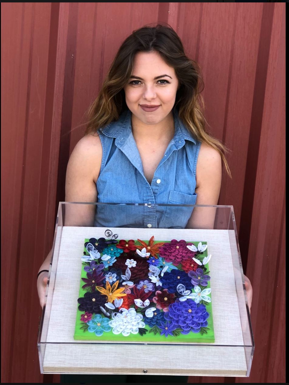 Hannah West with her quilling peice