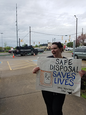 Pharmacy student promoting proper medication disposal