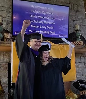 Carrie Cowart celebrating with her dad in front of the TV with her name shown