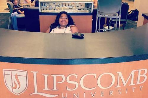 Savannah Miller at Welcome Desk in Bennett Campus Center