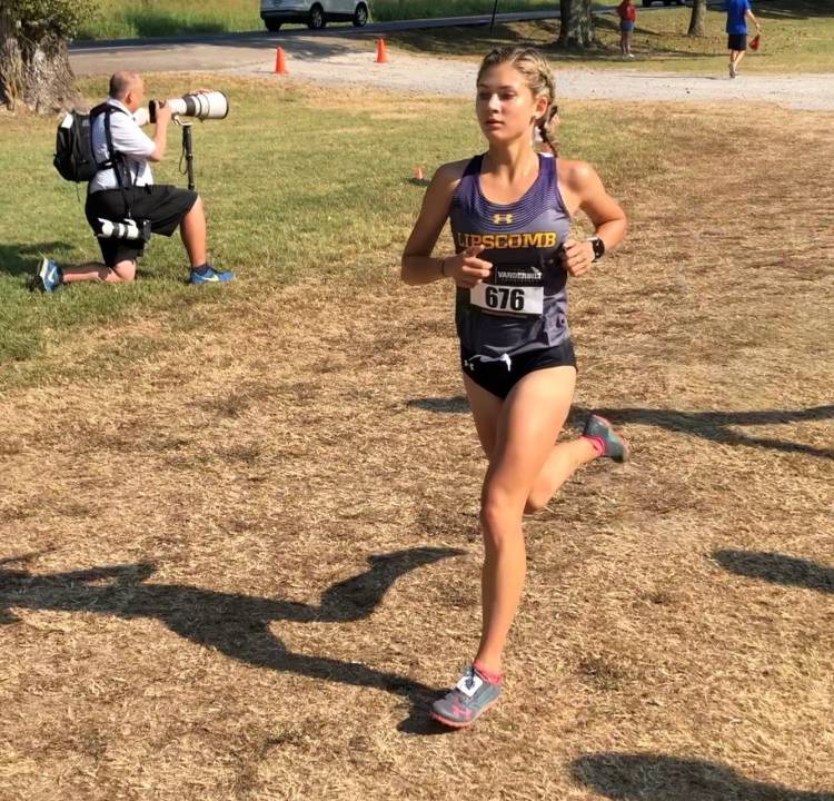 Lauren Flynt running cross country. 