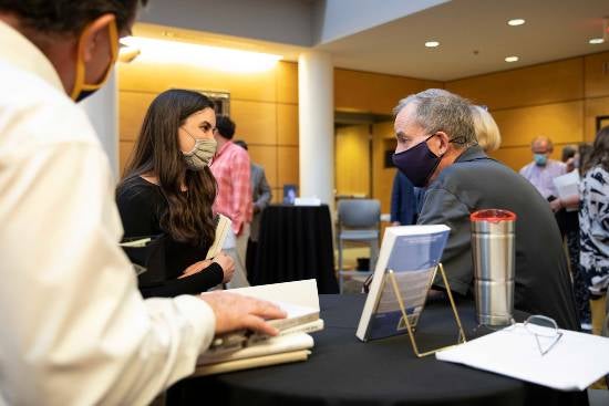 John Mark Hicks signing books. 