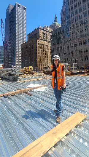 Christie Clayton standing on the third floor of the new JP Morgan skyscraper