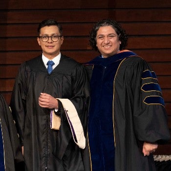 Dr. Sergio Licona and Dr. Julio Rivas in regalia at hooding ceremony