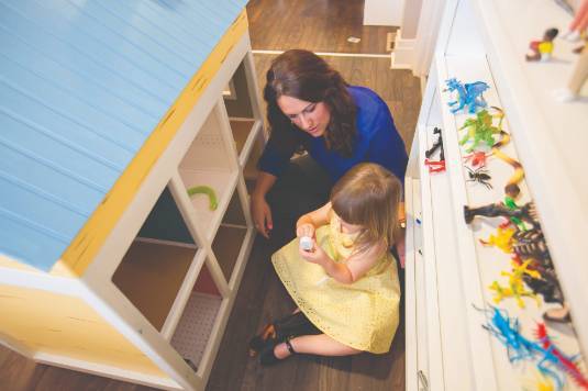 Counselor and child practicing play therapy