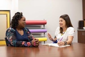 Dr. Ally Hauptman, one of the co-coordinators of the EA Fellows Program, meets with a fellow. The program was held up as a model in an education profession magazine in 2021.