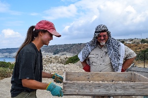 PH.D STUDENT KATHERINE HESLER, SIFTS THE SOIL ALONG WITH DR. TOM DAVIS, A DIRECTOR OF THE KOURION URBAN SPACE PROJECT, A MULTINATIONAL PROJECT IN CYPRUS