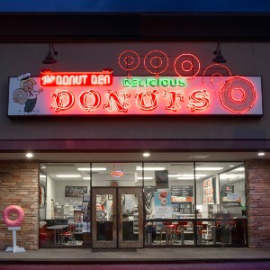 Donut Den exterior at night