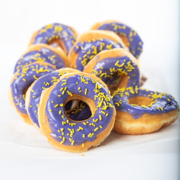 Purple donuts with yellow sprinkles