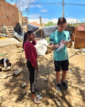 Danny Kotula standing with a young lady from Bolivia