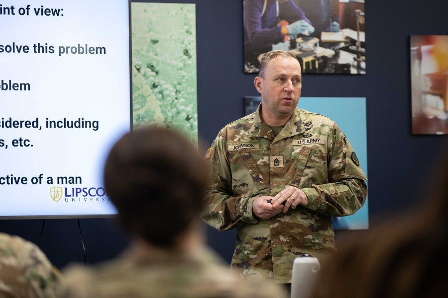 Guardsman presenting in the classroom